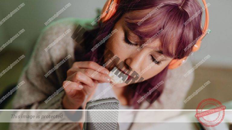 woman creating amsr sounds with headphones and food